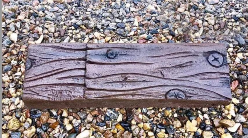 Natural stone texture looking like wood knots on rock bed