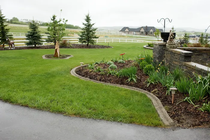 Exposed aggregate concrete curbing showcasing decorative design and durability