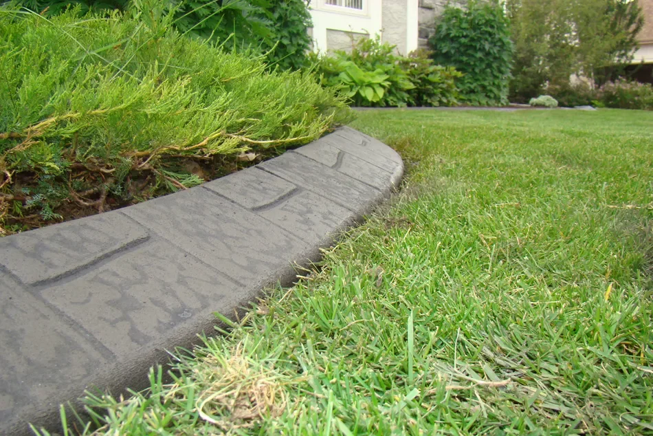 Creative Edge Curbing job with textured finish defining garden areas