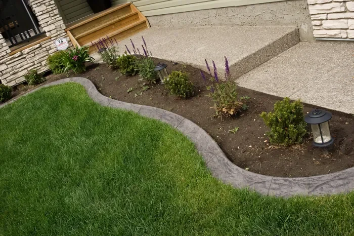 Spanish style concrete curbing in Calgary with clean modern profile