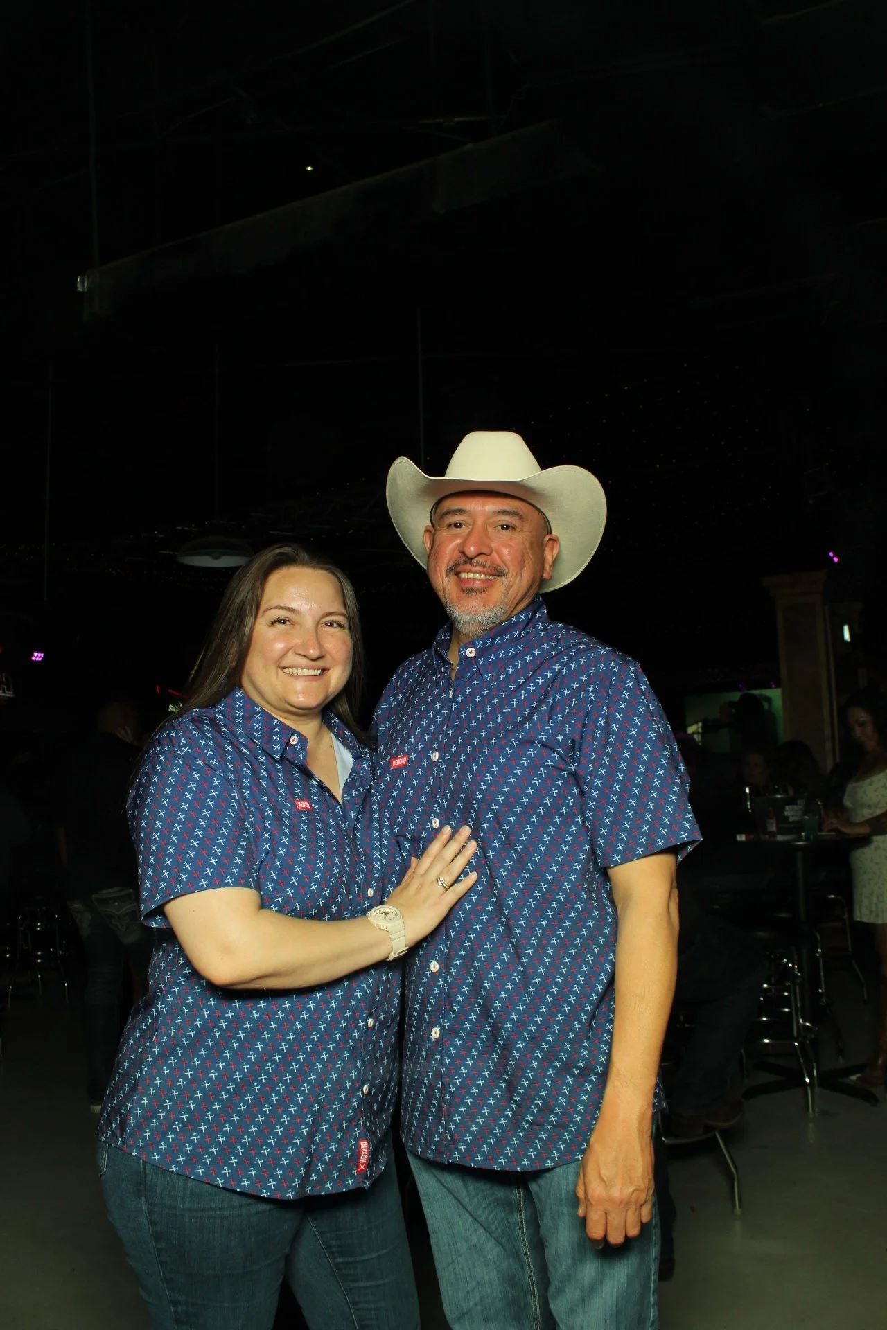 Couples posing for high-quality instant prints at a Mirror Air Booth Social Media Night in El Paso.