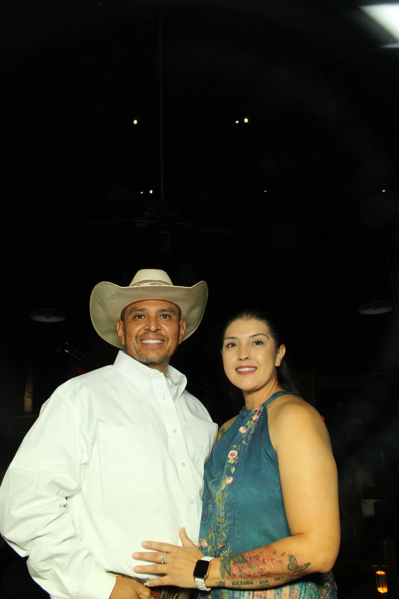 Nighttime Soft Opening celebration guests utilizing the full-length Mirror Air Booth in El Paso.