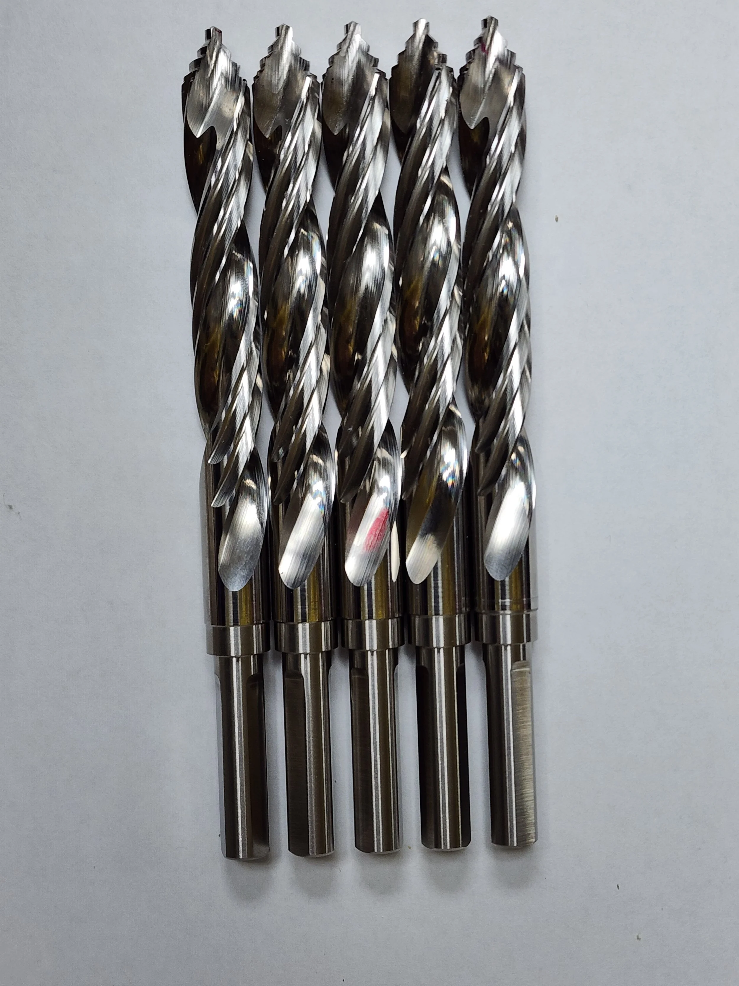 Solid carbide roughing end mills with serrated flutes for high material removal in CNC machining