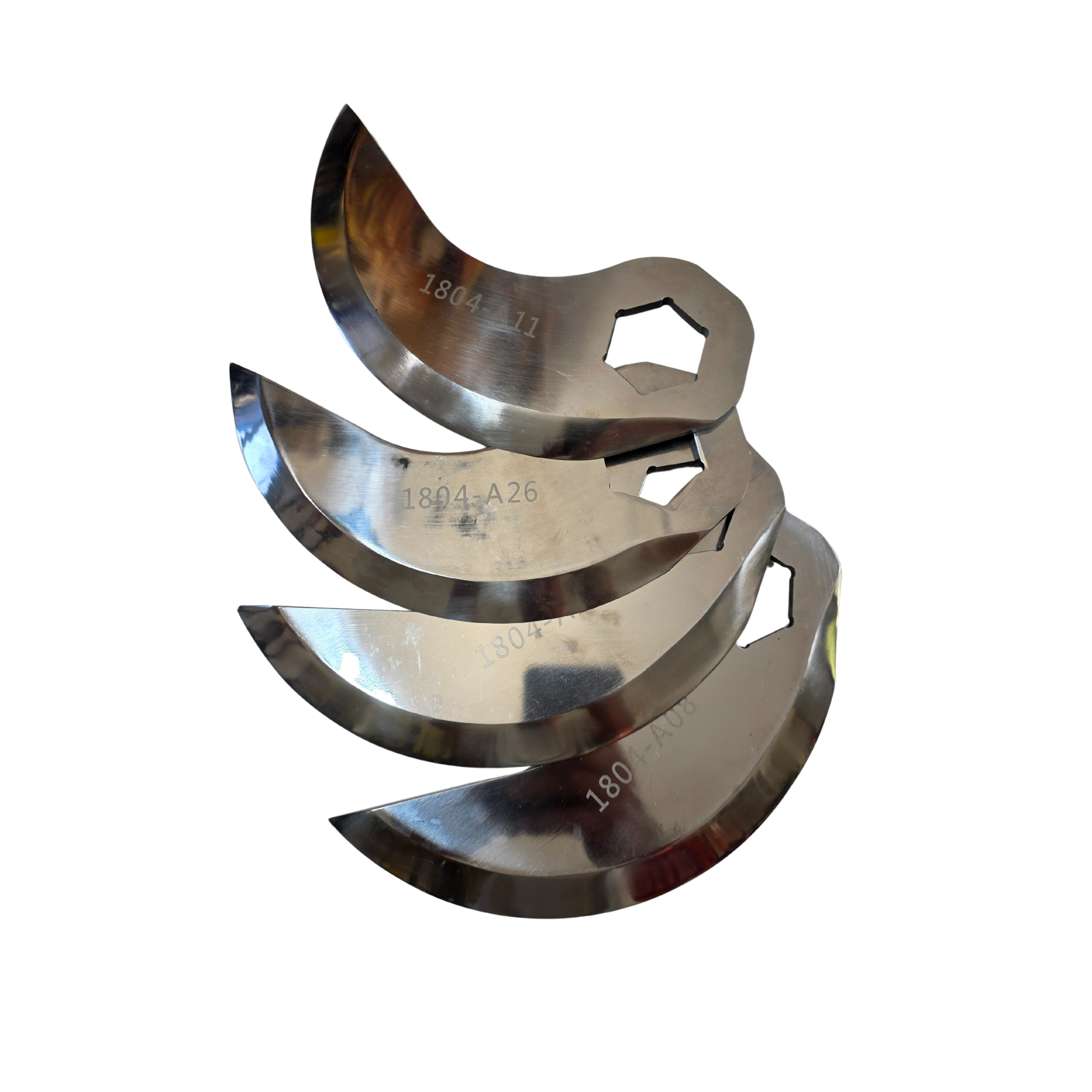 Set of four metal crescent-shaped engine bearing shells with hexagonal cutouts, reflecting light.