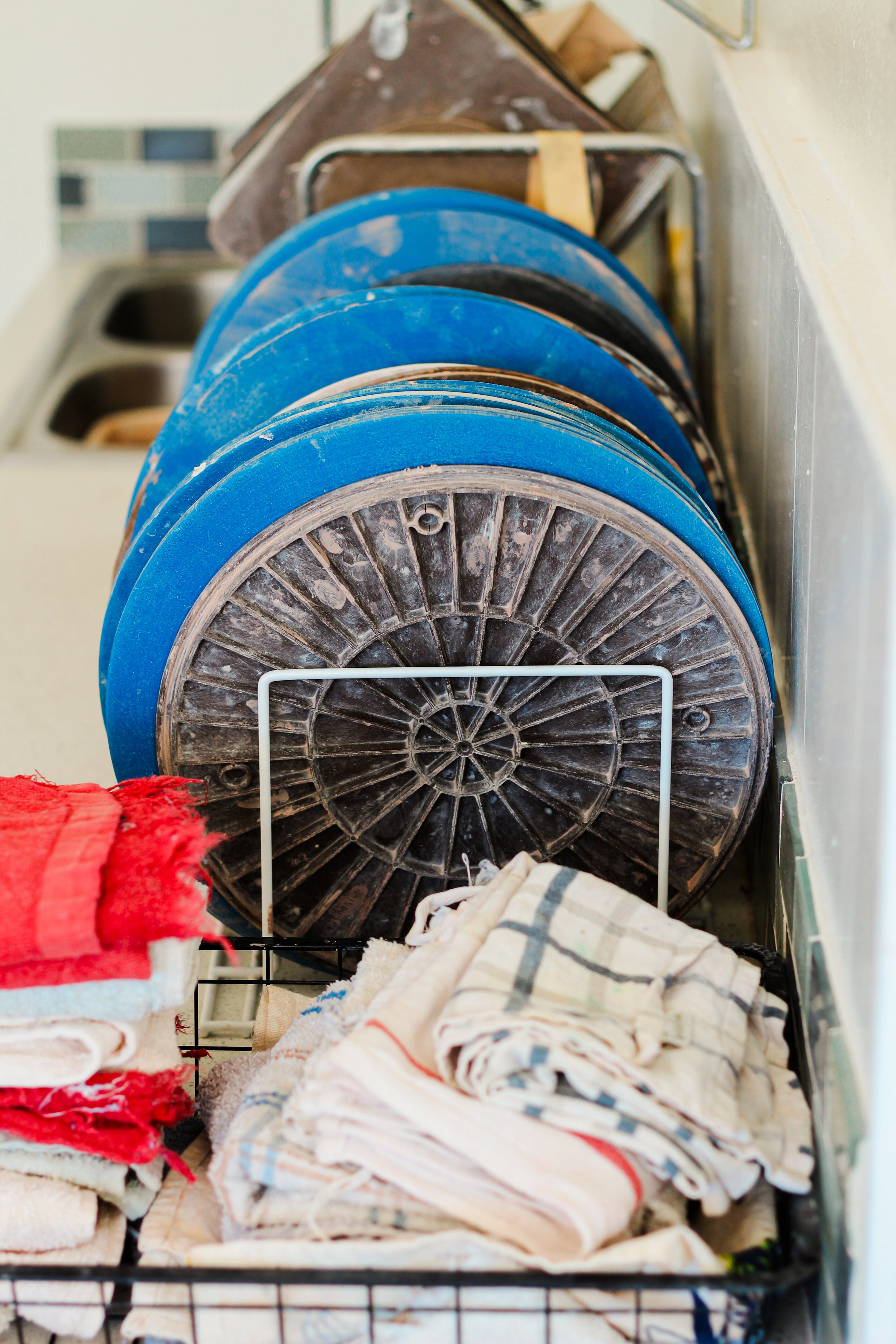 A collection of pottery supplies in a studio.