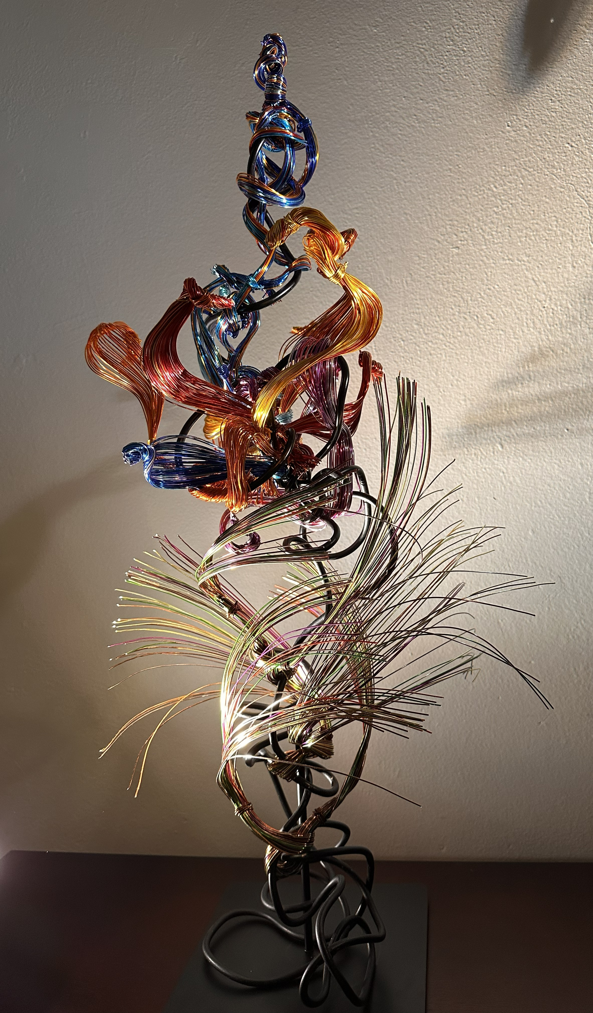 "Paradise" Full view from front with spot lighting 
Description:  Soft, spiraling forms lifting upward - a composition shaped by color, light, and upward energy.