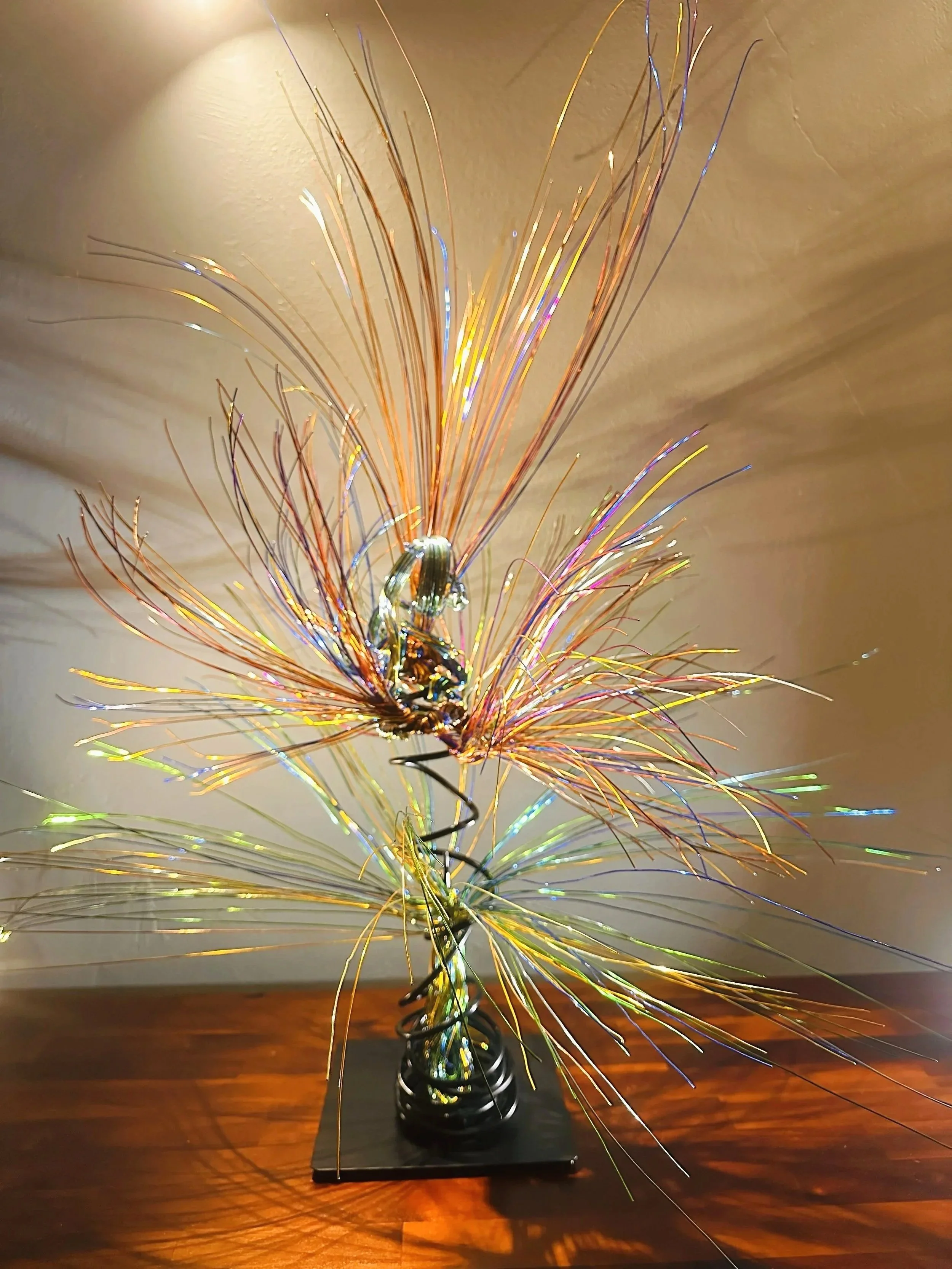 Title:  "Bloom" Close up
Dimensions: 2' 0" × 2' 0" × 3' 0"
A slender vertical lift, the wires rising in a narrow column before drifting outward. It feels like a thin current of air carrying something upward.