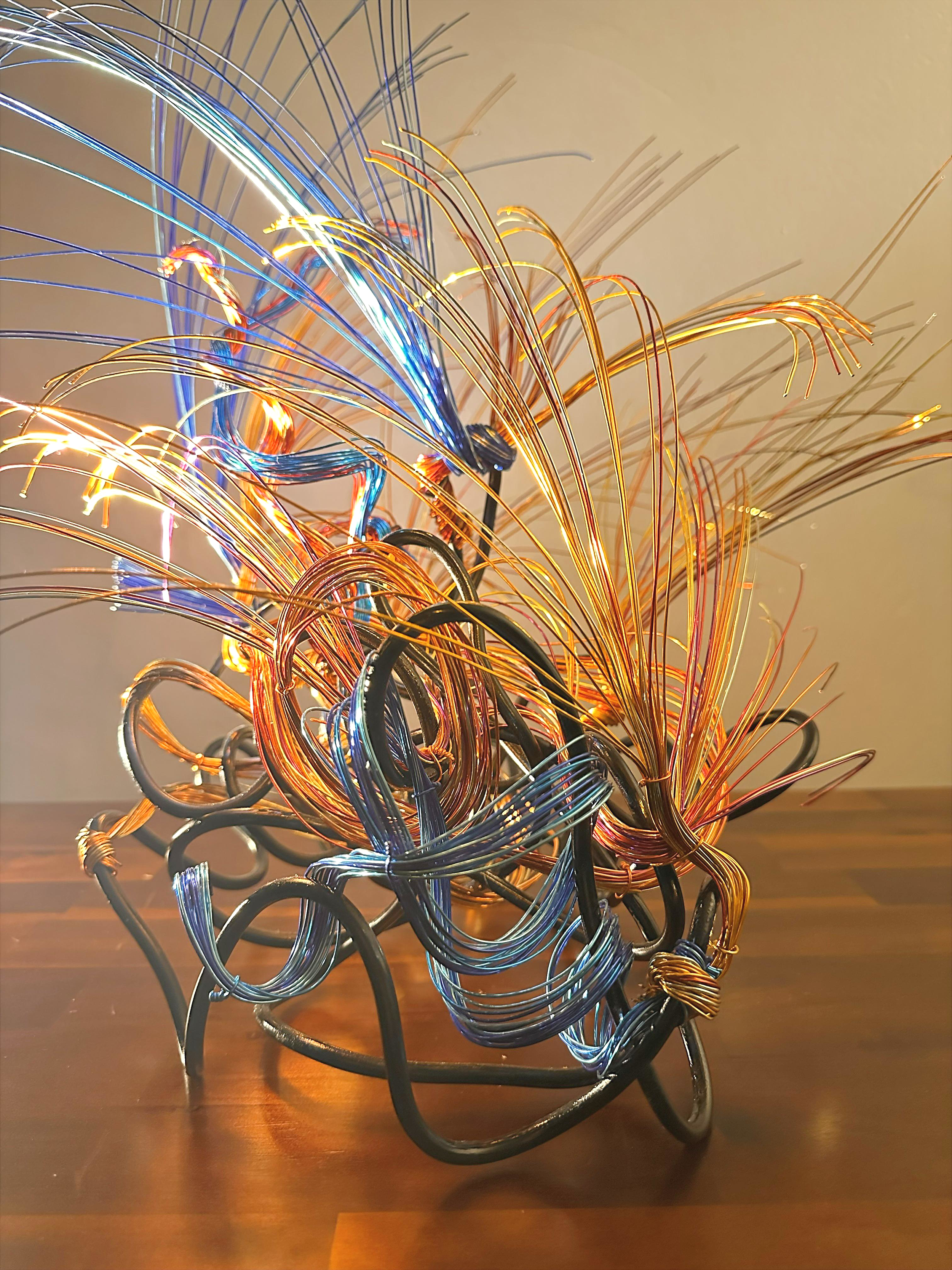 Title: "Releasing" View from side. 
Dimensions: 2' 4" × 1' 4" × 2' 0"
The sculpture tilts gently, as though responding to a subtle pull of light or wind. A quiet, directional piece that feels aware of its surroundings.