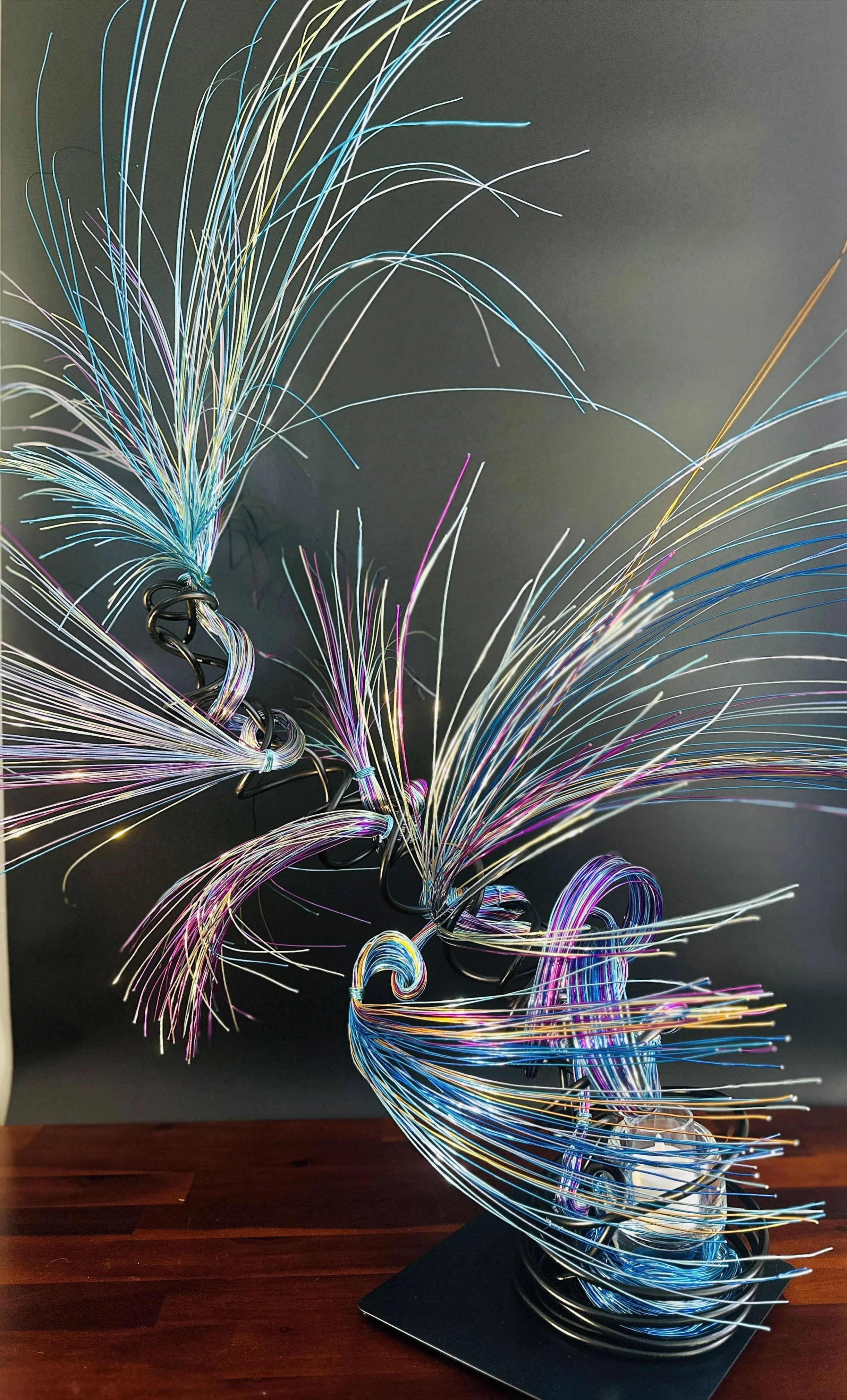 Title: "Rising"" View from front. Dimensions: 1' 6" × 1' 6" × 2' 5" The form stretches upward, its strands leaning into imagined air. A sculpture that feels mid movement — rooted below, reaching toward the sky