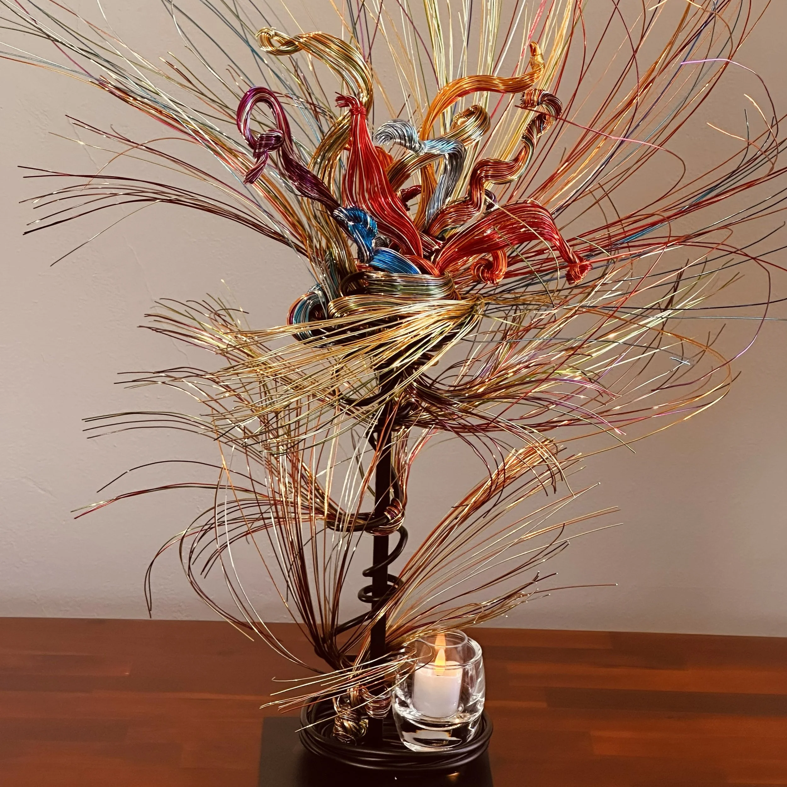 Title:  "Paradise"  2" x 2" 2" x 10'
An abstract wire sculpture inspired by the bird‑of‑paradise, shaped with vibrant color, airy movement, and the feeling of a lush, living environment.