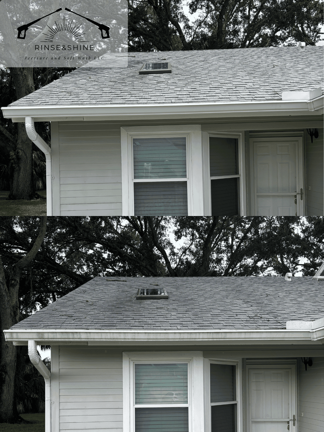 Side view of a house with a gray shingled roof, white siding, a skylight, a window with blinds, and a door, with trees in the background.