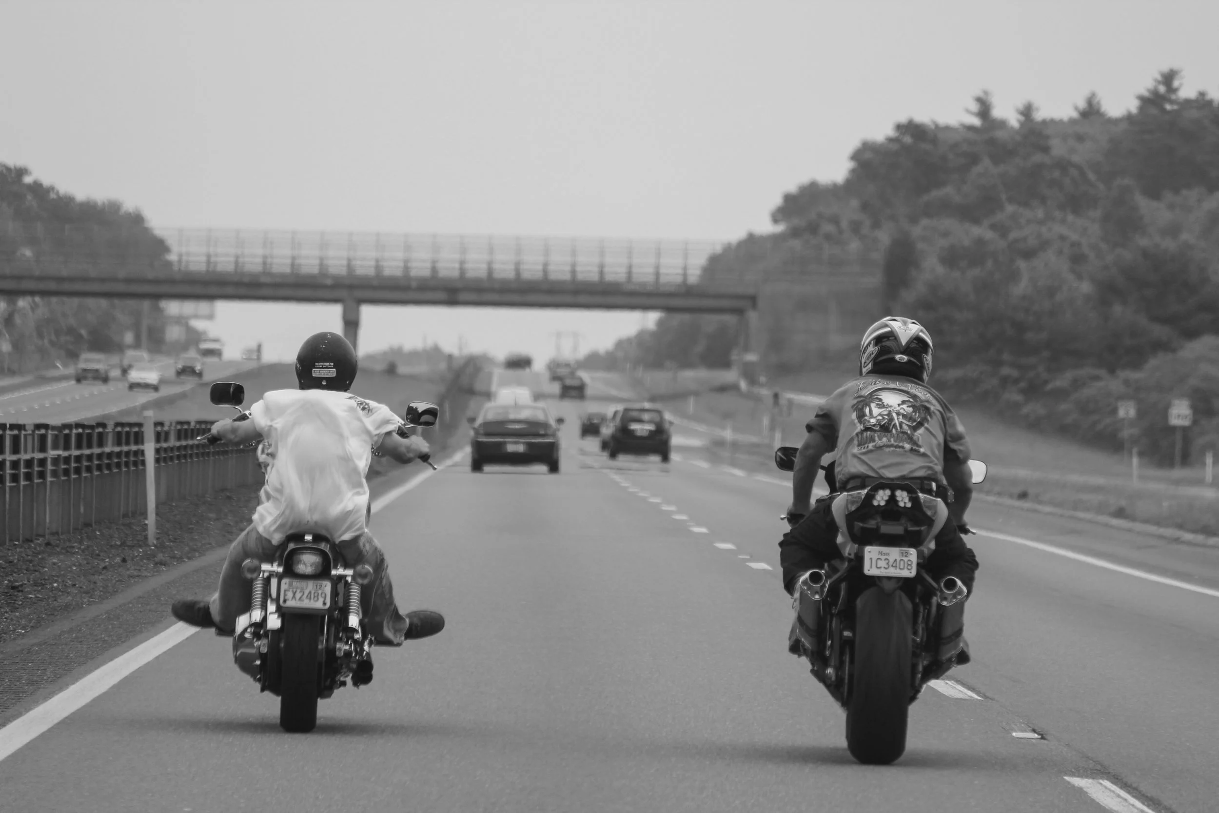 Two men riding their bikes