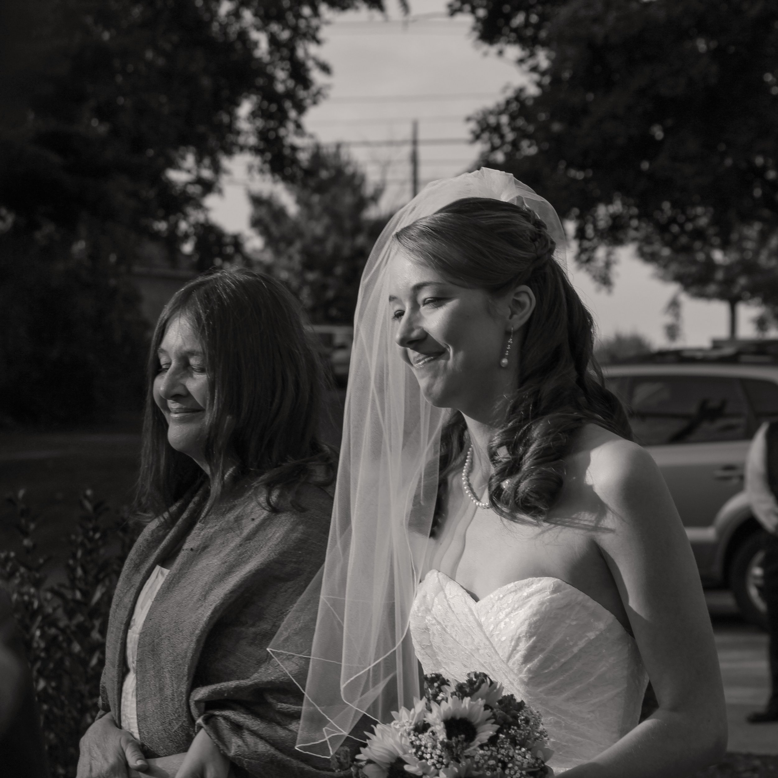 Bride walks down aisle with her mom