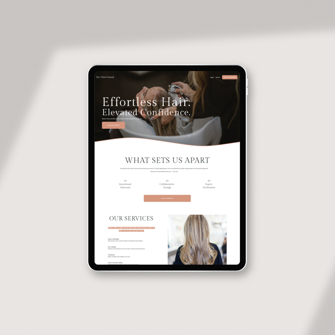 A tablet displaying a website for a hair salon featuring an image of a woman receiving a hair treatment and text about hair services.