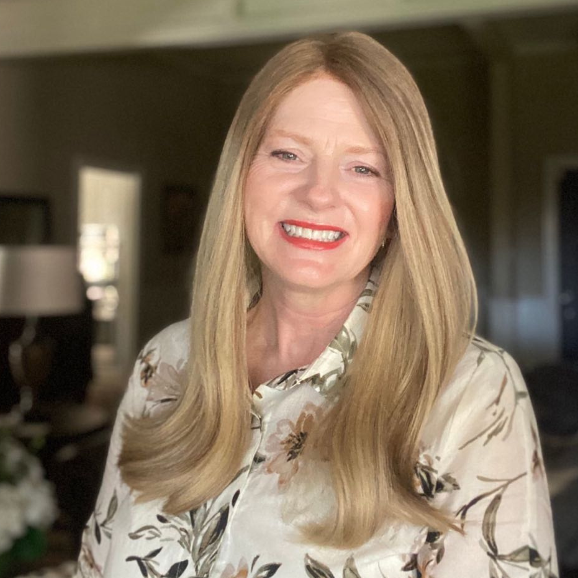 Hadassah Bauer Functional Health and Nutrition Coach wearing a white blouse with black leaf patterns.