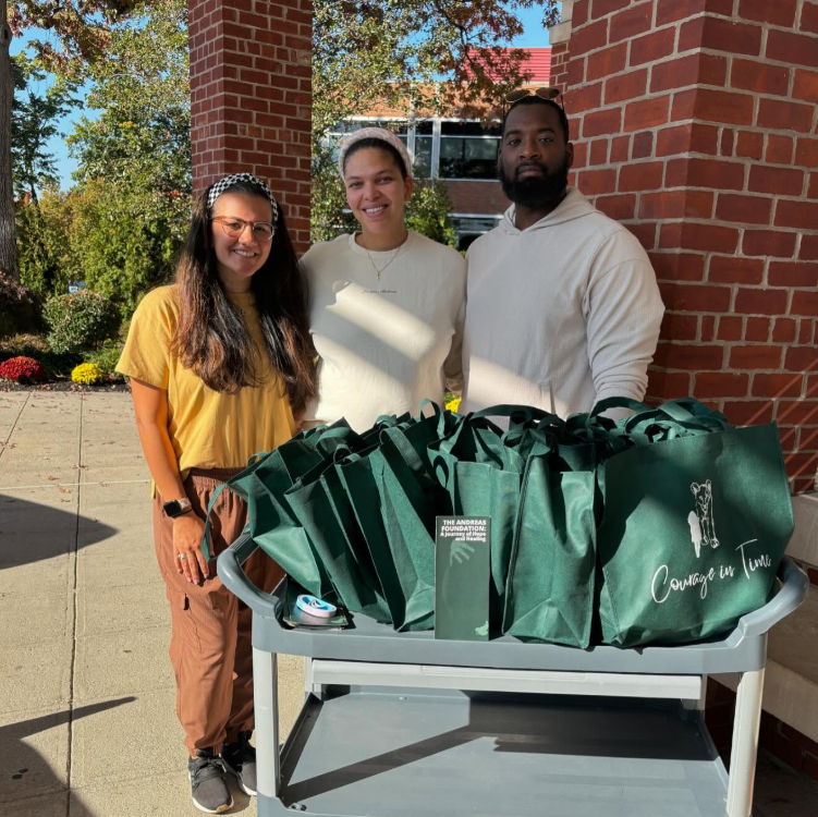 Volunteers with The Andreas Foundation distributing support bags as part of a community outreach initiative.