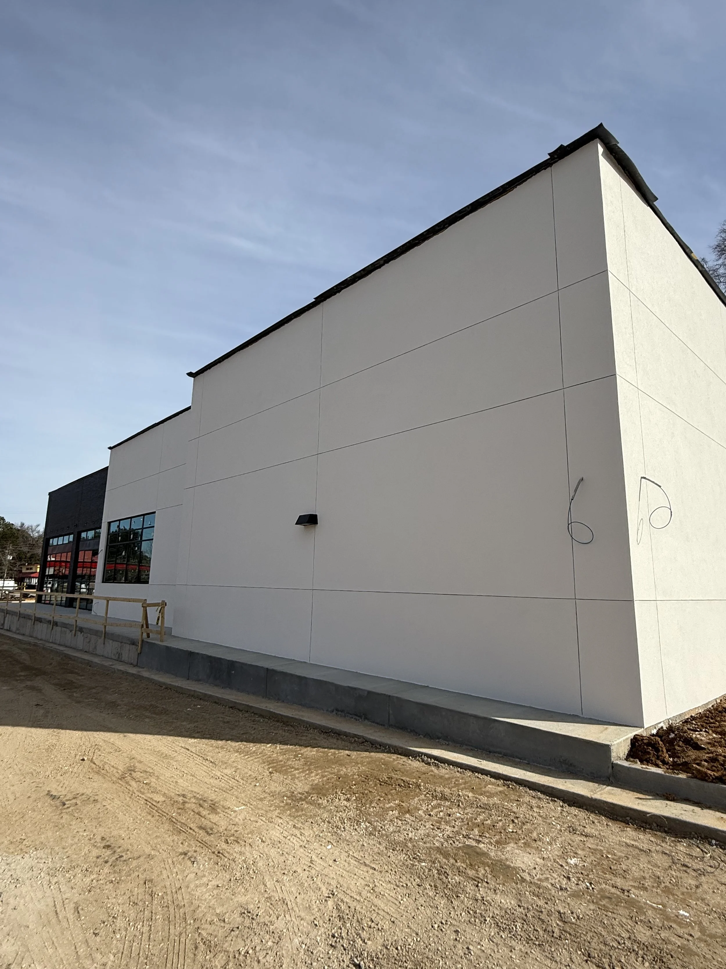 Exterior of a modern building with white stucco panels