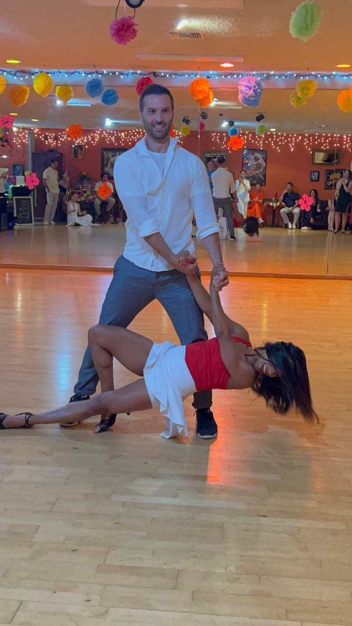 Two YCD Studio students performing at a social dance event in Hermosa Beach