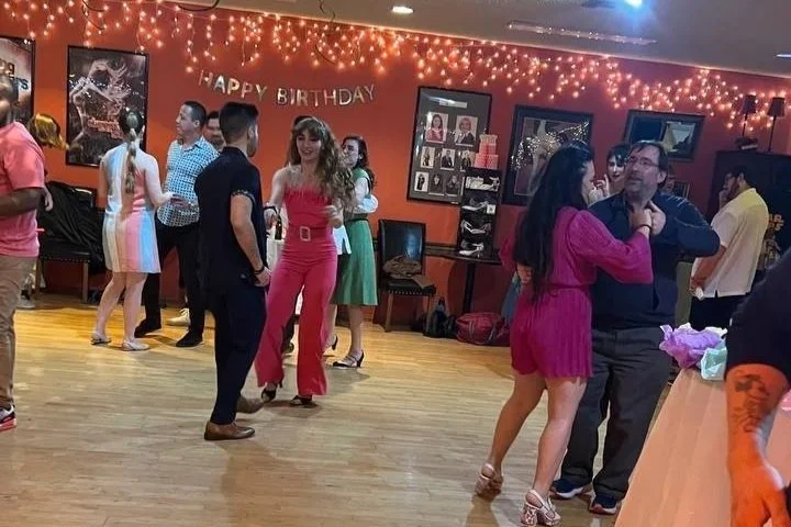 Adults dancing and mingling at a YCD Studio social dance party in Hermosa Beach