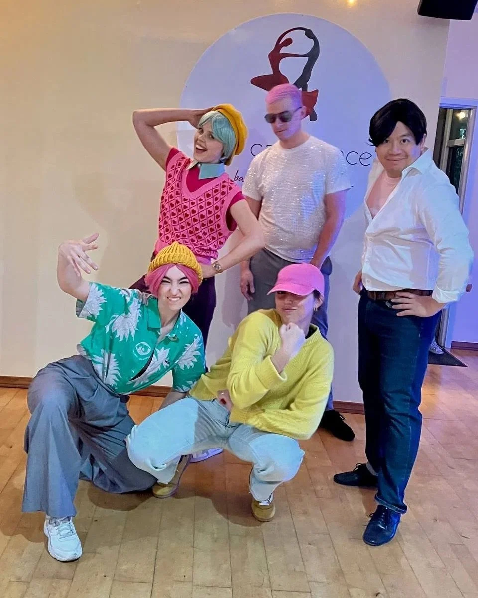 YCD Studio instructors, including co-owner Anna Trebunskaya, celebrating Halloween with students at a studio social