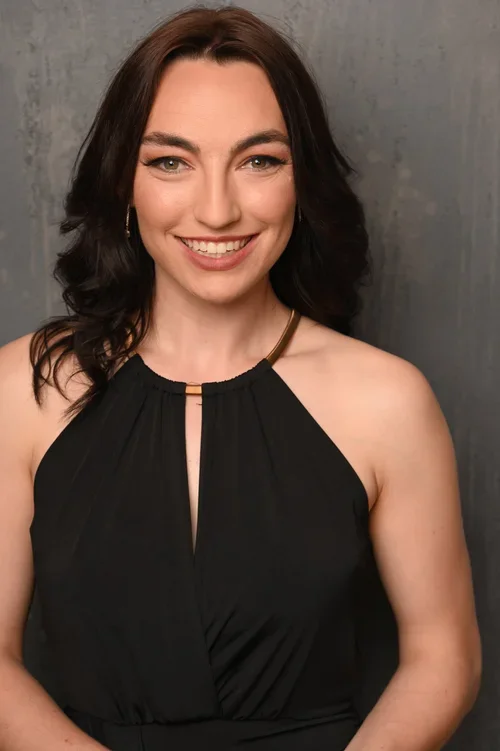 headshot of a dance instructor and studio staff member in a ballroom setting