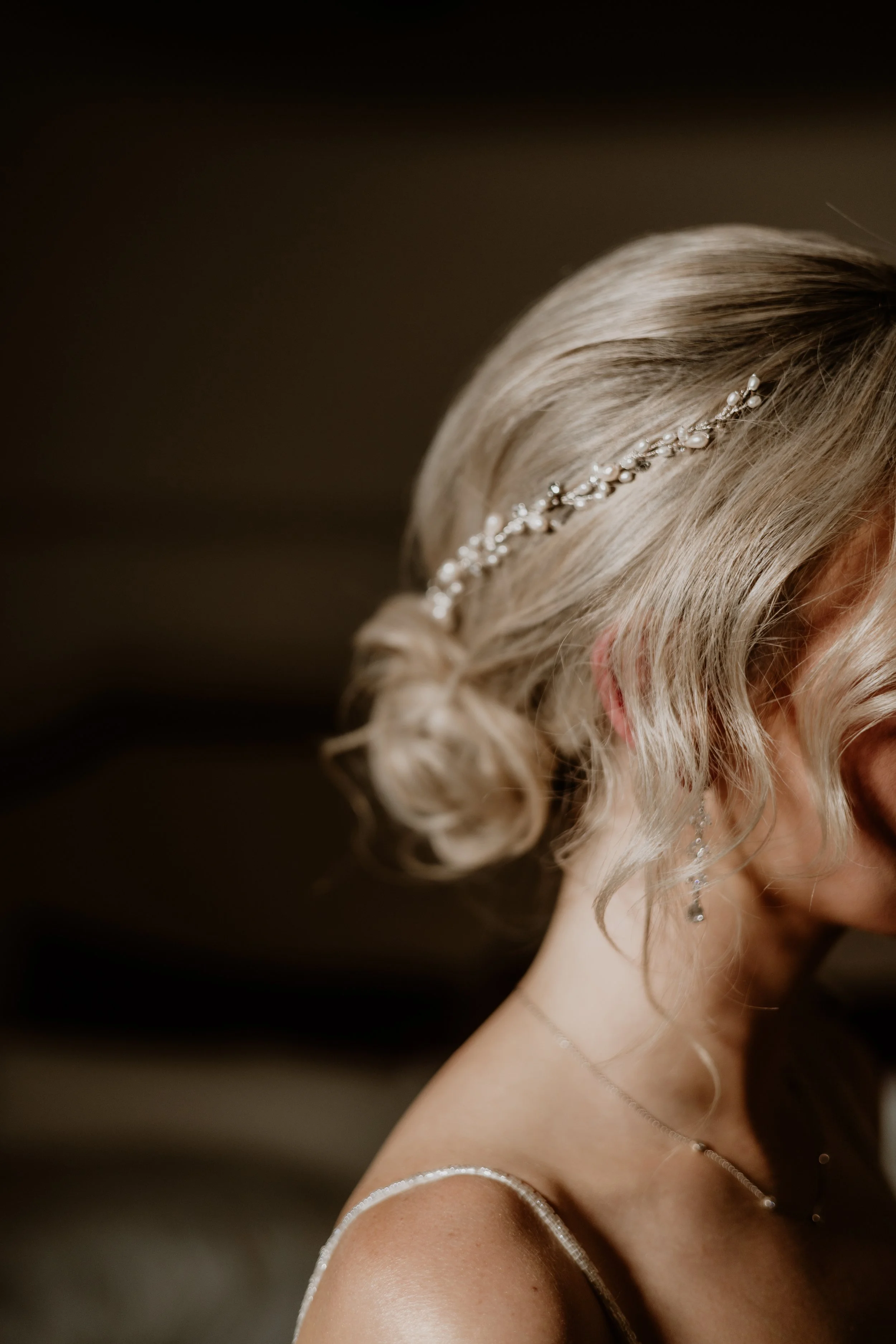 Romantic bridal updo with soft texture and volume, styled by a Kentucky bridal hair specialist.