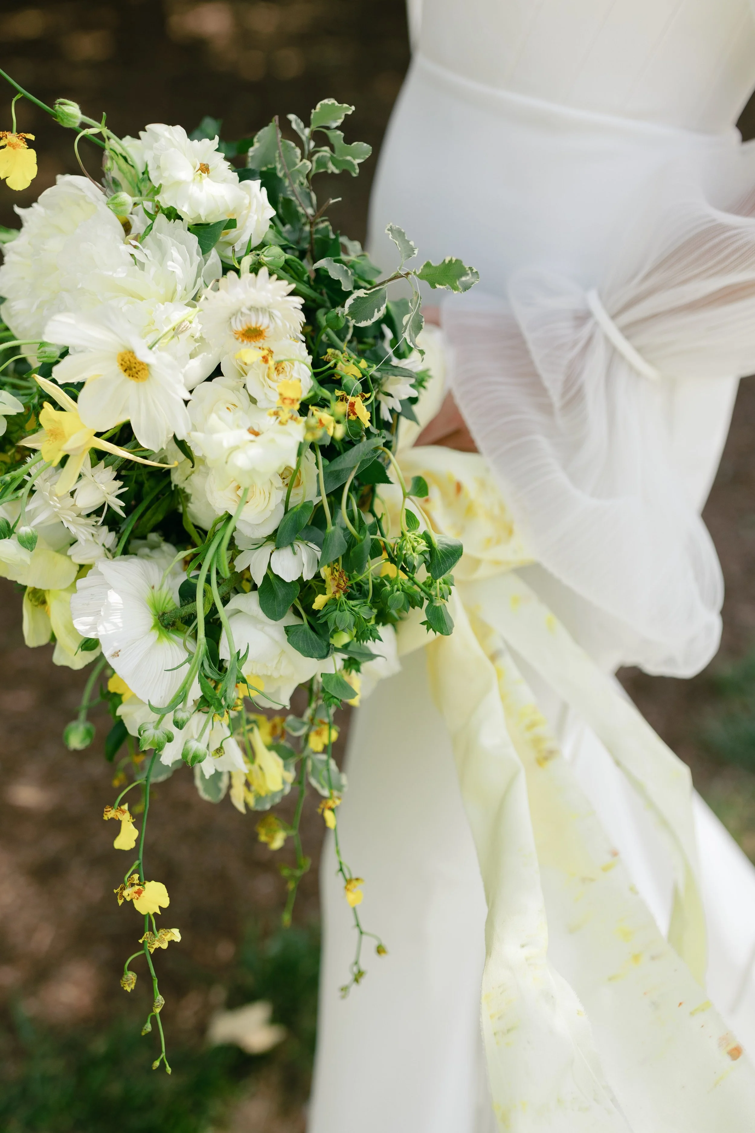 Bridal bouquet with white and yellow florals, natural light wedding detail captured by a Northern California wedding photographer.