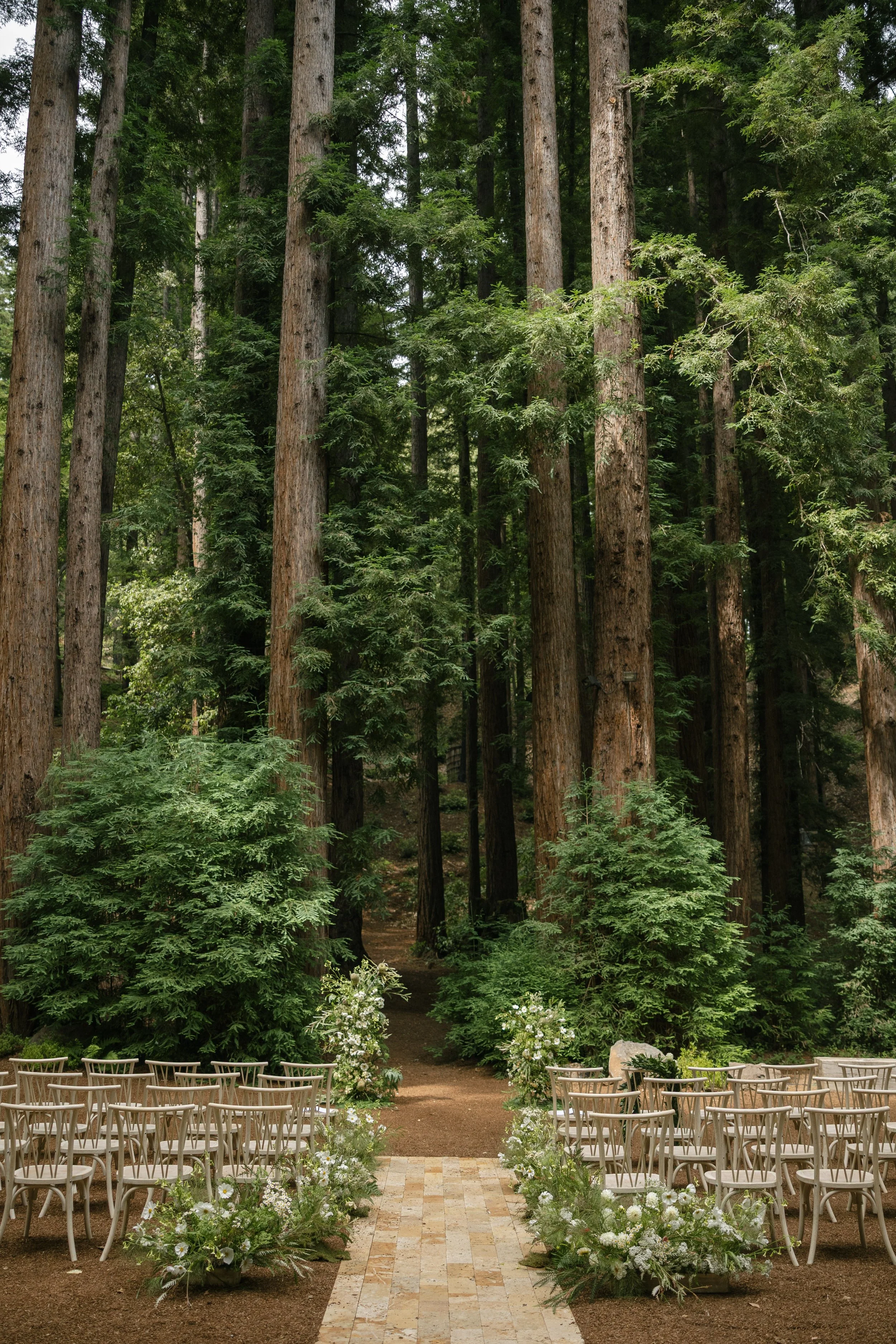 Bay Area redwood forest wedding ceremony with lush floral aisle design, outdoor ceremony inspiration.