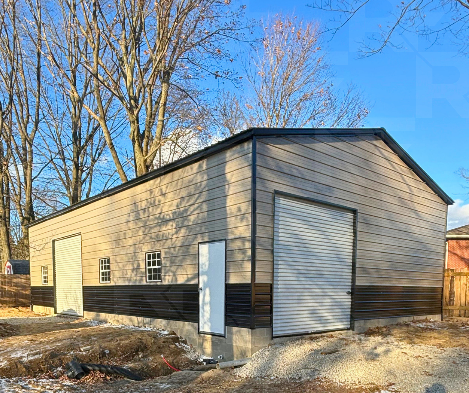 Black and beige metal workshop and garage installed on concrete.