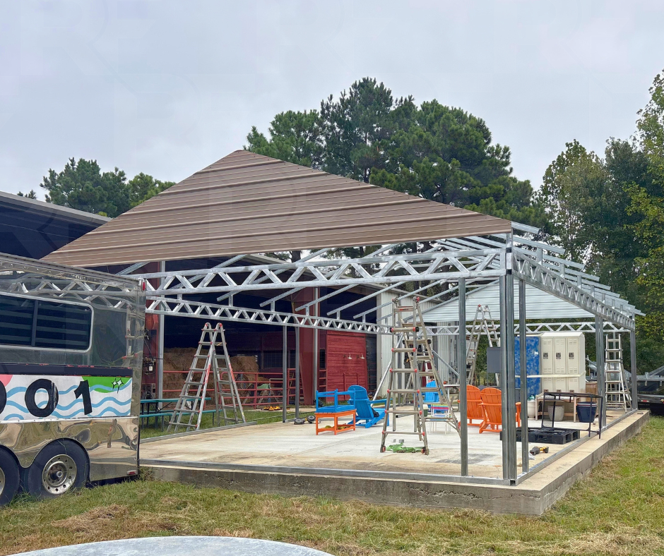 Metal pavilion with 4/12 roof pitch and extended gabled ends