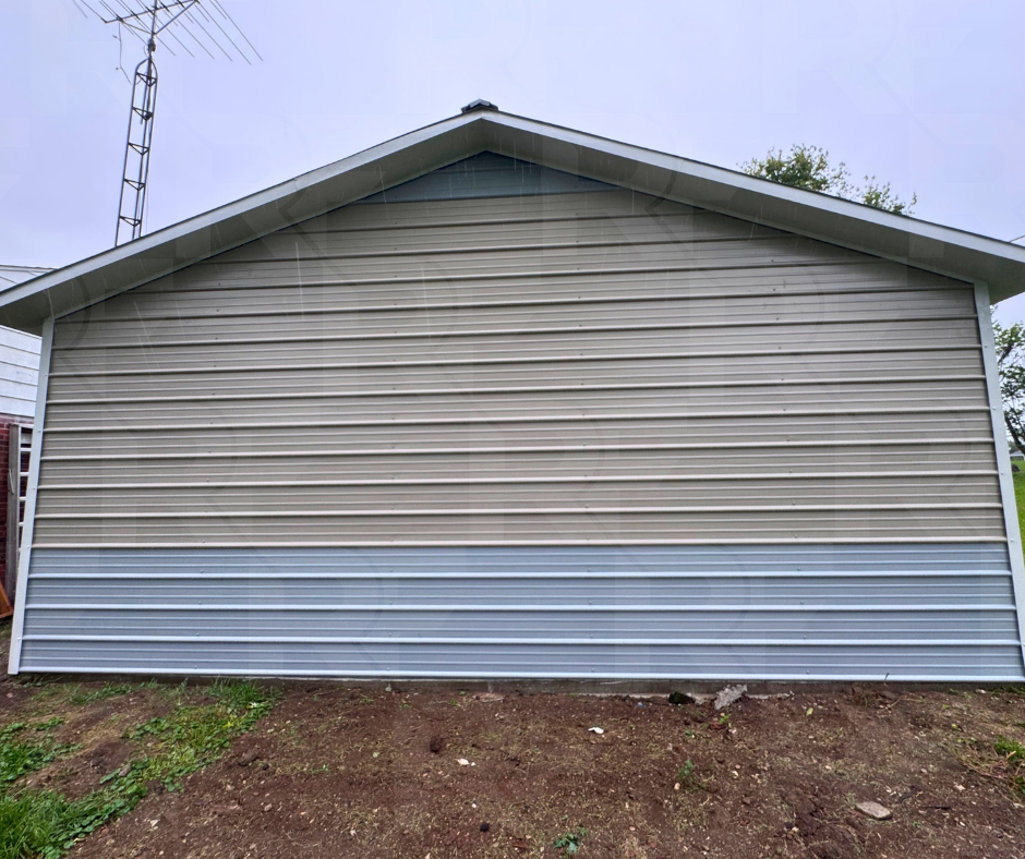Metal garage with one-foot roof overhangs