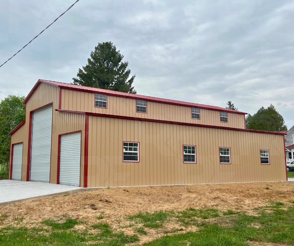 Metal farm building featuring three front roll-up doors