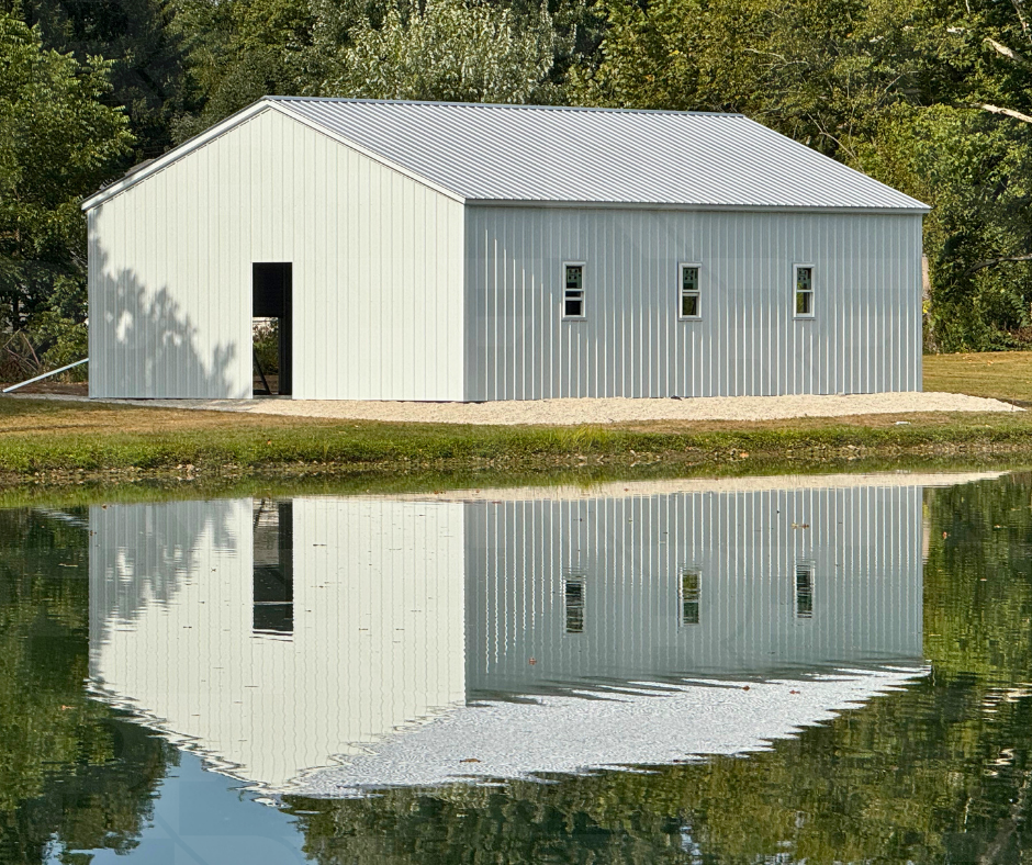 26×40×10 white metal garage in Dayton, Ohio with pond reflection