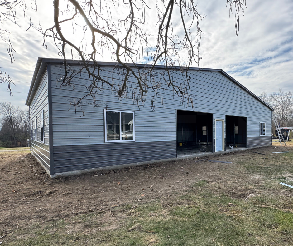 Custom equipment storage building with enclosed side wings and open center workspace.