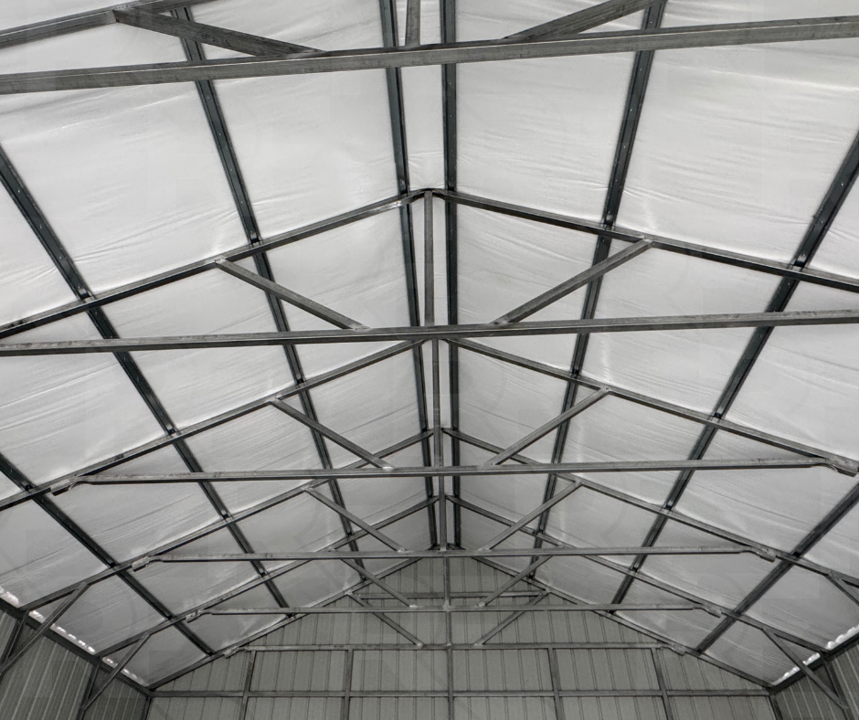 Residential-style metal garage with vertical siding and insulated roof.
