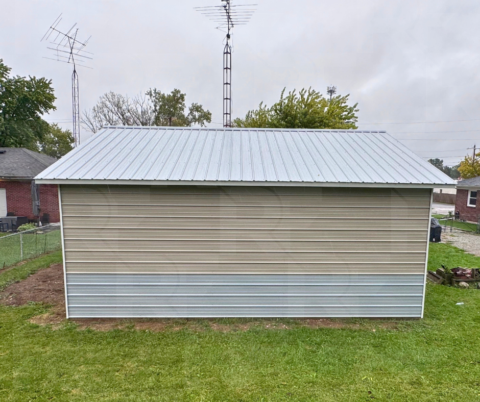 1. Completed metal garage with pitched roof and clay trim