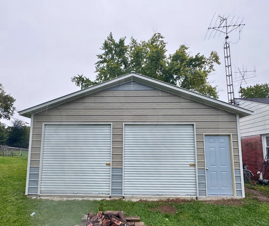 Two-tone metal garage with two roll-up doors