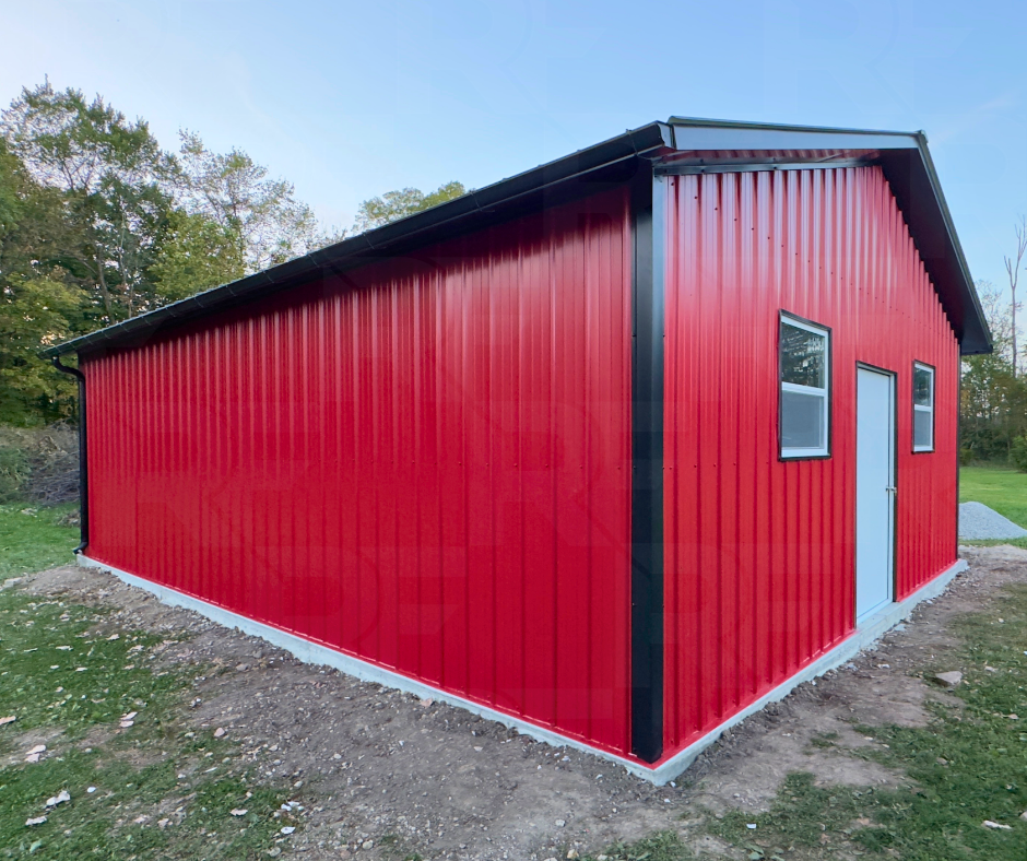 1. Completed red metal building with black roof and trim in Ohio