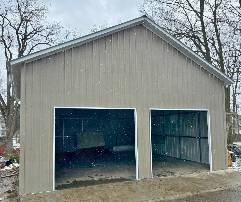 Vertical steel garage with two framed garage door openings.