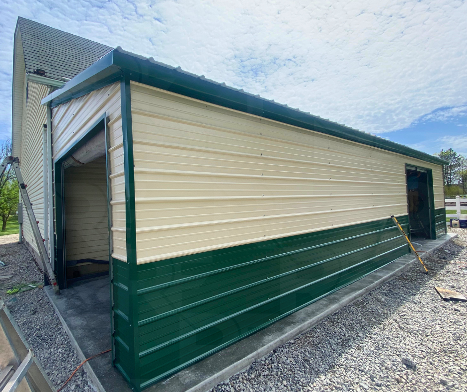 Attached steel garage addition with two roll-up garage doors