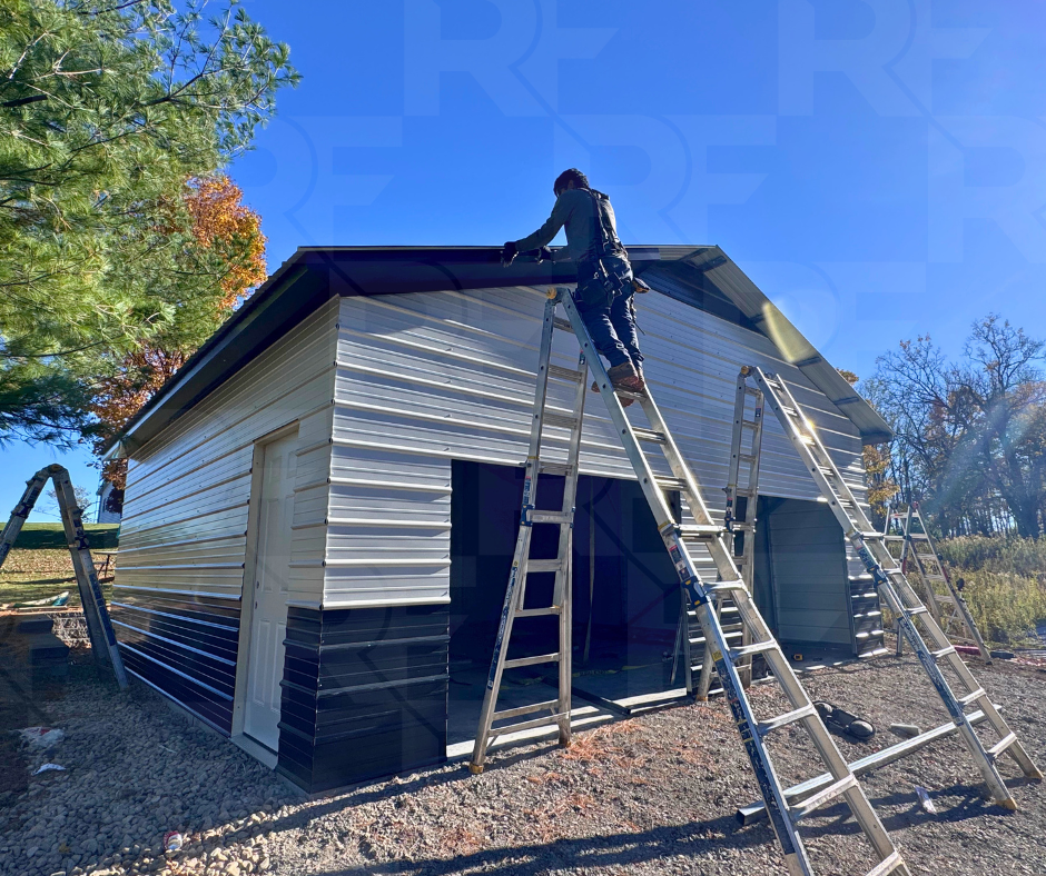 Custom metal garage with black accent panel at roof peak