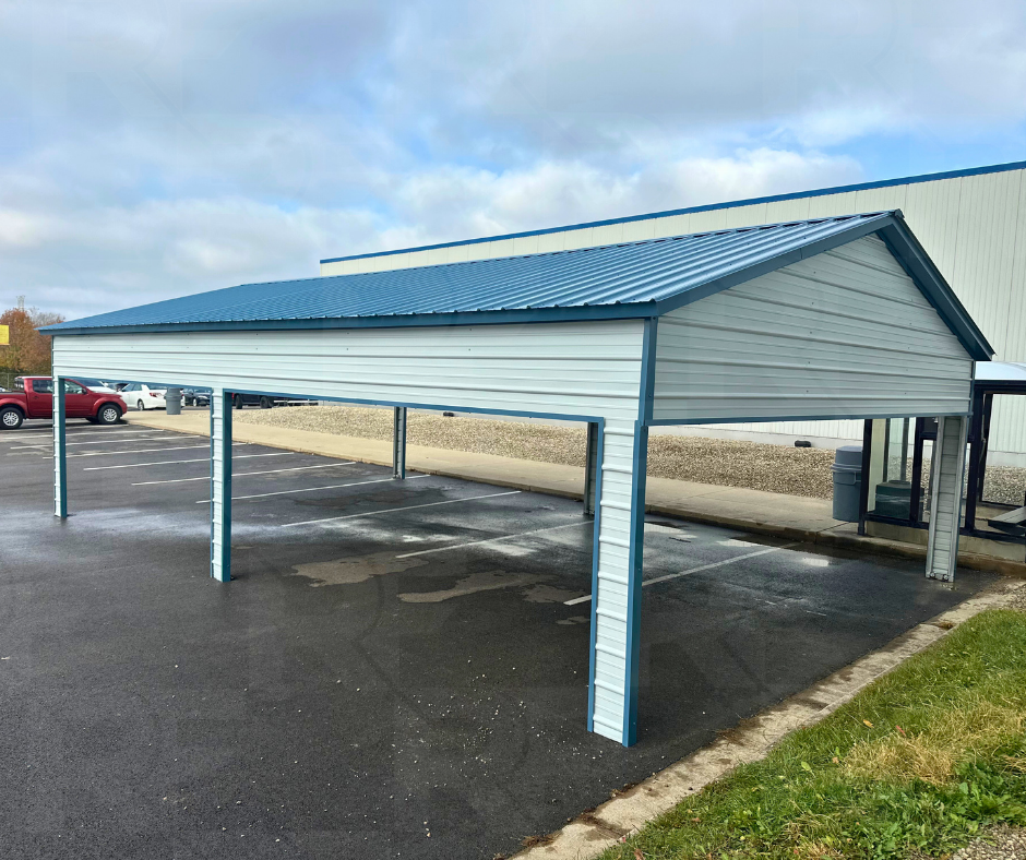 Open metal pavilion providing covered outdoor seating for employees