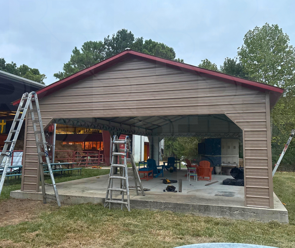 Open-sided steel building with horizontal metal siding