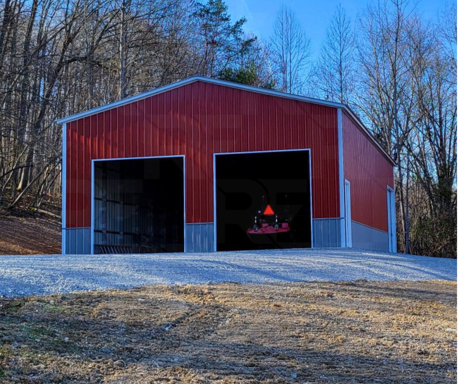 Steel equipment storage building with insulated roof and multiple garage bays.