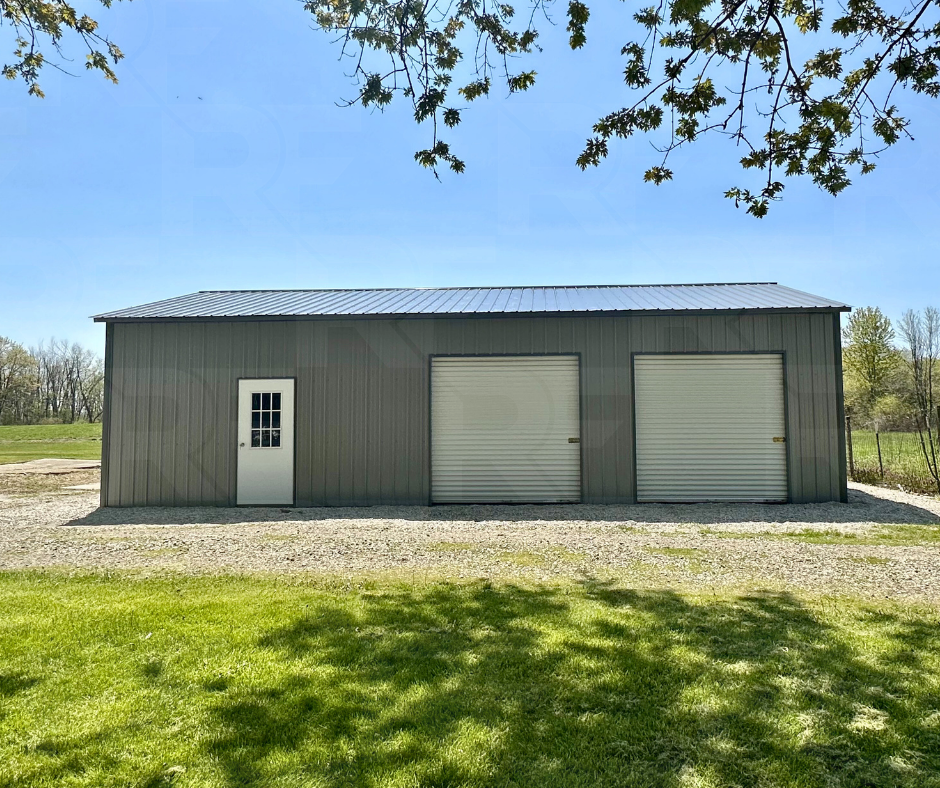 24x40 metal garage and shop with 2 - 8x8 roll doors and vertical siding.