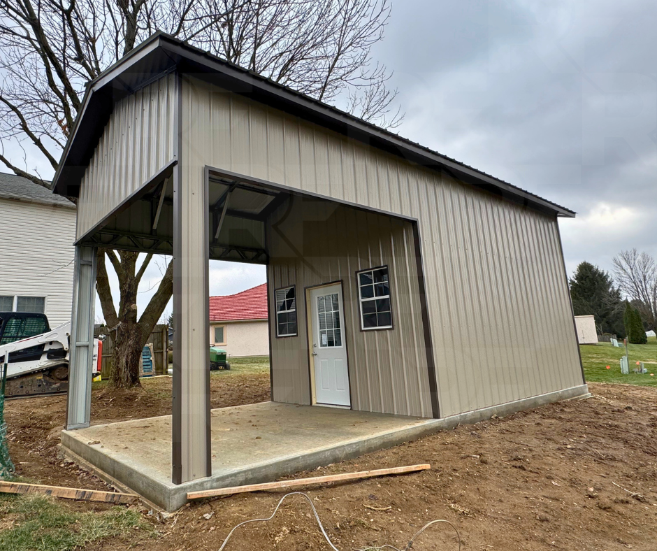 Metal outdoor living structure with framed openings and residential entry door.