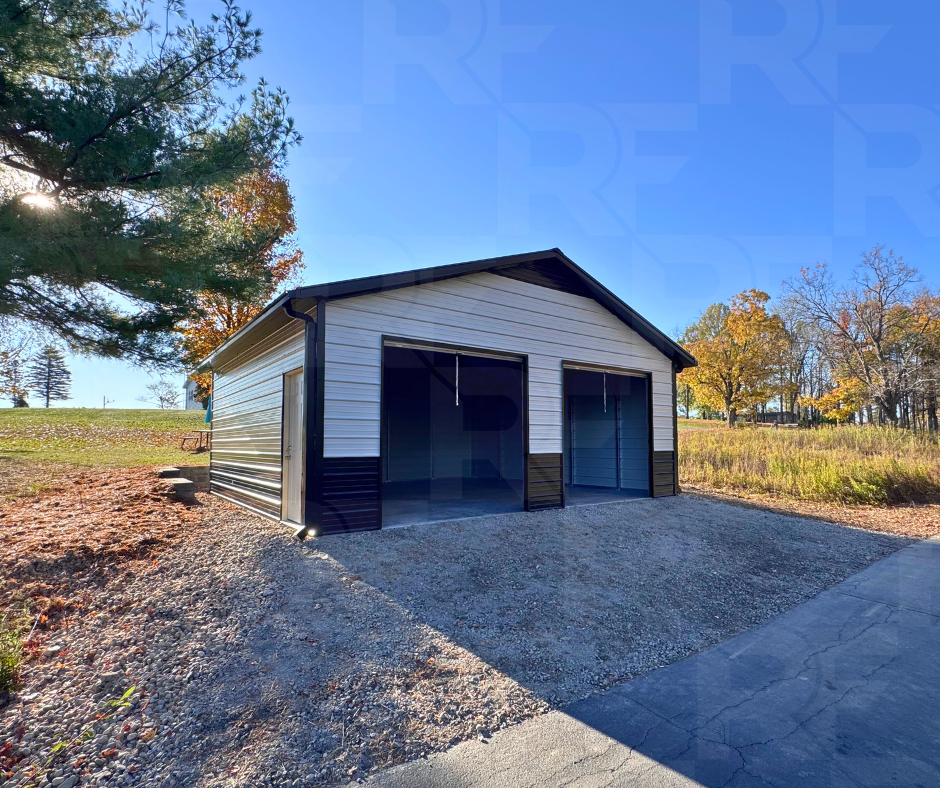 1. Completed metal garage with white siding and black trim