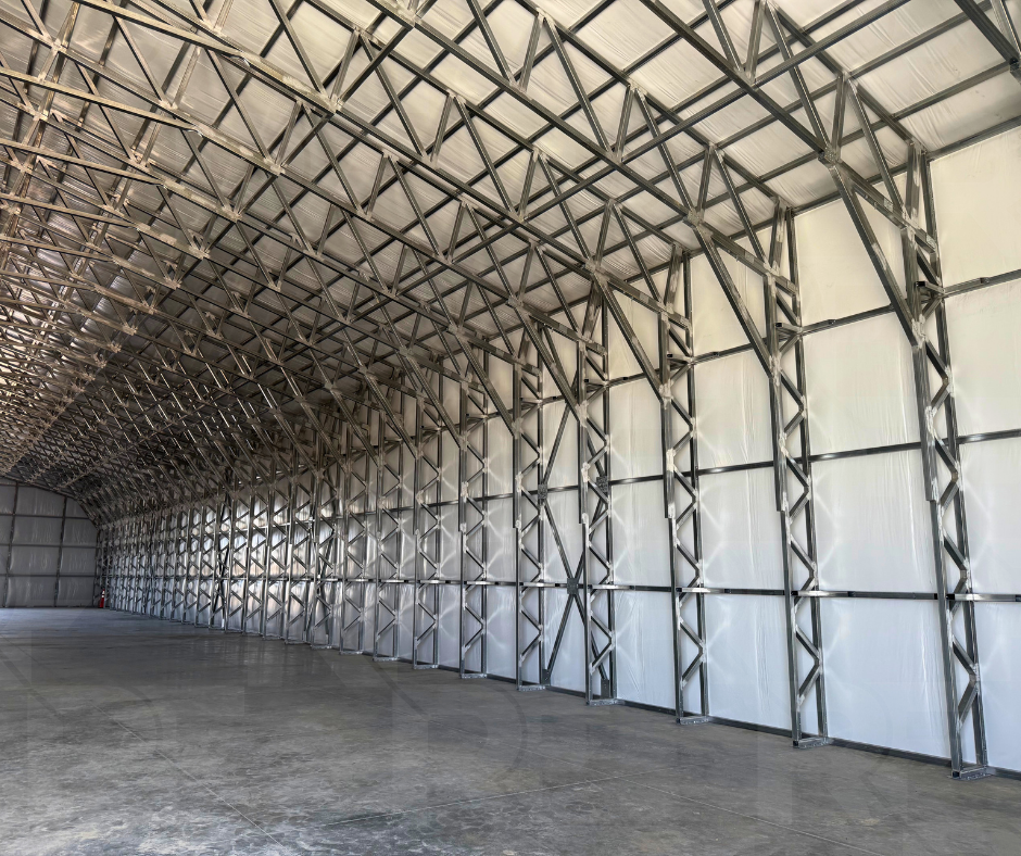 60-foot-wide metal building with large equipment access doors