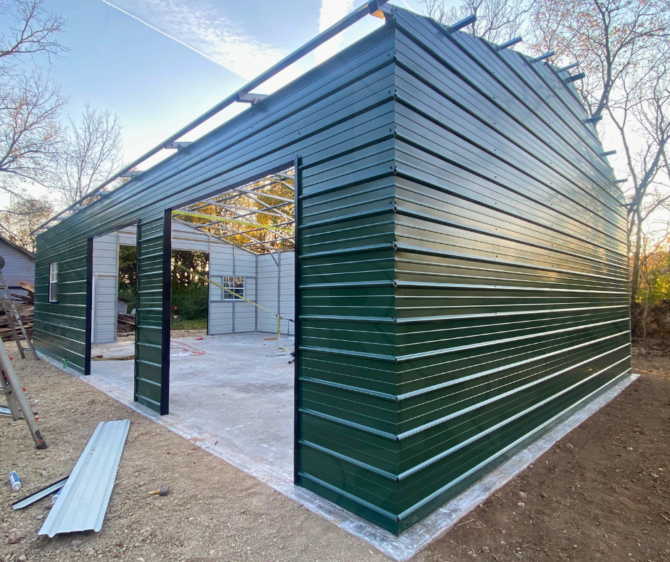 Metal garage under construction during steel frame installation