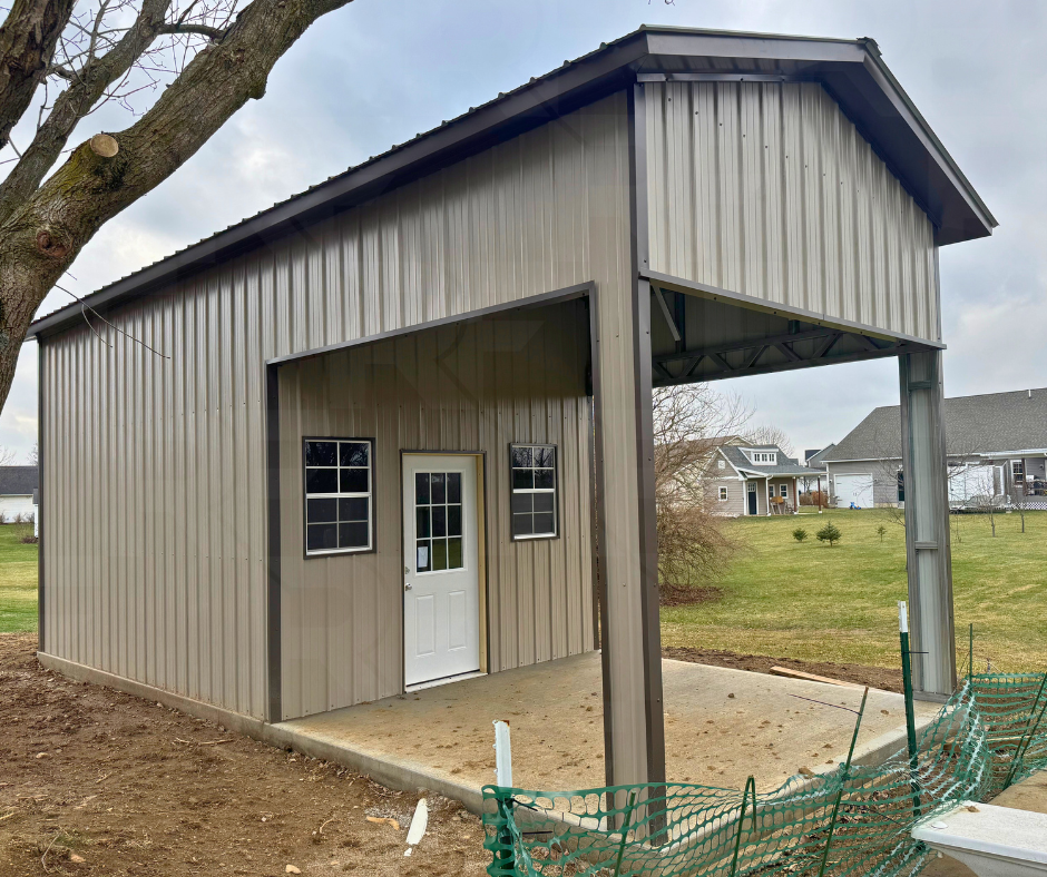 Steel pool house with large covered patio and enclosed storage room.